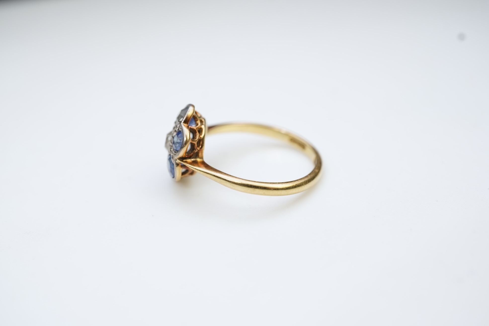 A sapphire and diamond cluster ring, early 20th century
